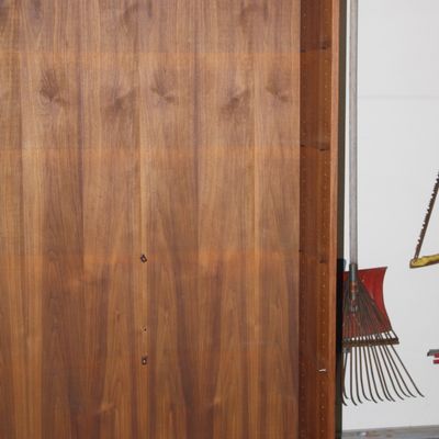 Sale Photo Thumbnail #139: Mid-century modern teak bookshelf cabinet featuring adjustable shelf tracks and a rich natural wood grain finish.
