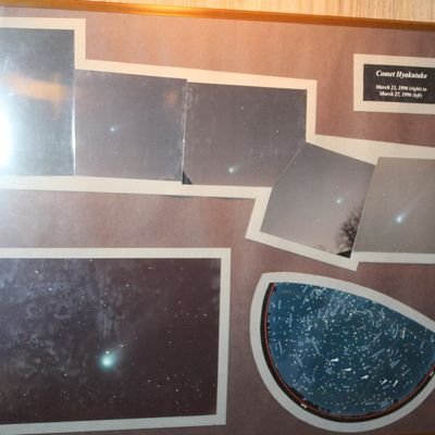 Sale Photo Thumbnail #85: Framed collage of astrophotography depicting Comet Hyakutake from March 1996, set behind glass in a thin metallic frame.