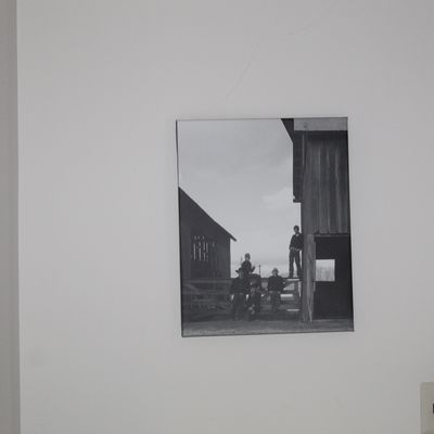 Sale Photo Thumbnail #26: Black and white canvas wall art featuring a rustic farm scene with figures gathered near a barn.