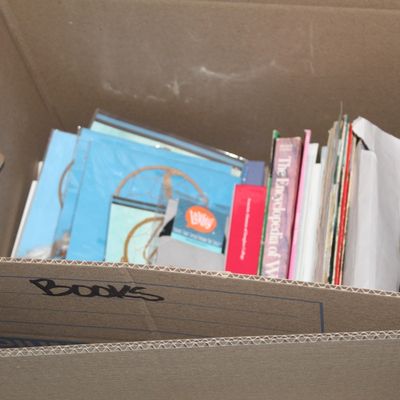 Sale Photo Thumbnail #155: Cardboard box labeled "Books" containing an assortment of books, paper goods, and packaged craft or educational items.