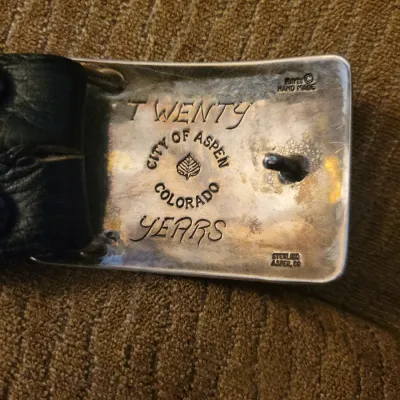 Sale Photo Thumbnail #44: Hayes Aspen belt buckle presented by the city of Aspen for twenty years of work.