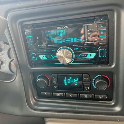 Sale Photo Thumbnail #37: Kenwood DPX502BT double-DIN car stereo receiver installed in a vehicle dashboard, featuring Bluetooth and SiriusXM readiness.