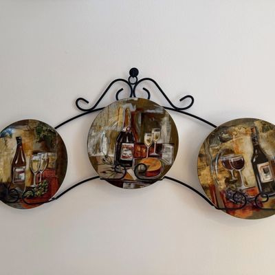 Sale Photo Thumbnail #7: Set of three Tuscany-style decorative wine plates mounted in a black wrought iron wall rack.