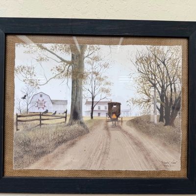 Sale Photo Thumbnail #9: Framed watercolor art print titled "Headin' Home" by Billy Jacobs, featuring an Amish horse and buggy on a country road, mounted on a burlap mat in a dark wood frame.