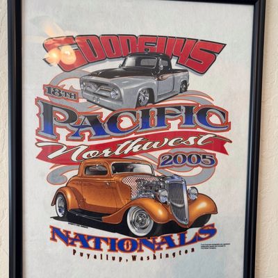 Sale Photo Thumbnail #11: Framed Goodguys 18th Pacific Northwest Nationals 2005 poster featuring hot rod and classic pickup graphics, housed in a simple black frame.