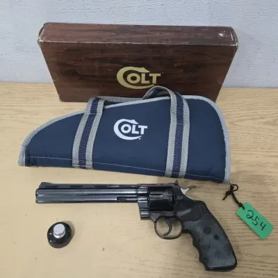 Sale Photo Thumbnail #7: Colt Python 1981 Model I3680 357 Mag Revolver 8" Barrel # K17099
Original Box - Pachmayr Gripper Rubber Grips With Embedded Colt Gold Medallion