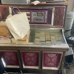 Sale Photo Thumbnail #37: Vintage 1972 Rowe AMI Silver Sage Jukebox – MM-6 – 200 Selections

A great find for jukebox collectors, vintage music enthusiasts, restorers, or anyone looking for an authentic piece of American entertainment history.

This Rowe International Silver S