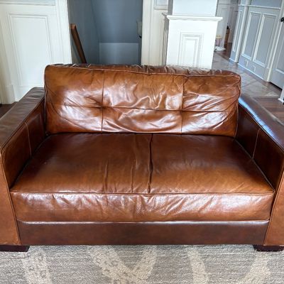Sale Photo Thumbnail #29: brown  leather loveseat $399
60X39X32"