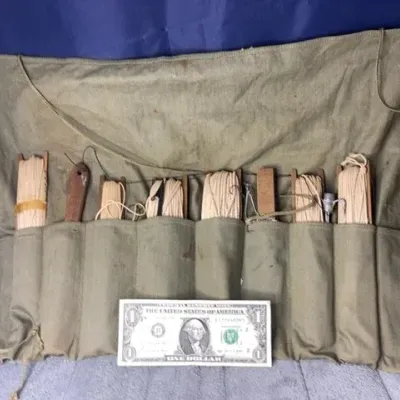 Vintage military fishing kit with canvas roll up bag. 