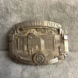 Vintage 1989 Frontier Days brass belt buckle, commemorating the 1938 Community Building in Douglass, Kansas, featuring a Lions Club...