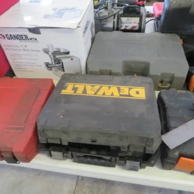 Sale Photo Thumbnail #34: Collection of power tool hard carrying cases, including a DeWalt case, a red Mac Tools case, a handsaw, and a boxed Gander Mountain electric meat grinder.