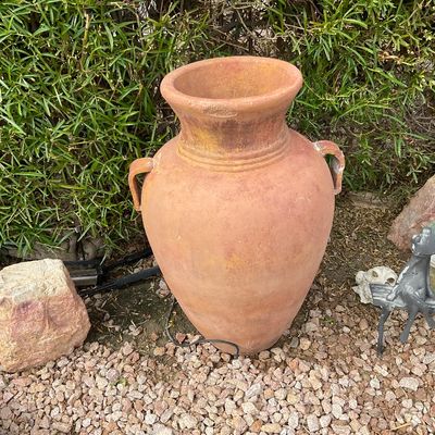 Sale Photo Thumbnail #35: Large terracotta amphora-style urn planter with dual handles, displaying natural distressing and weathered patina.