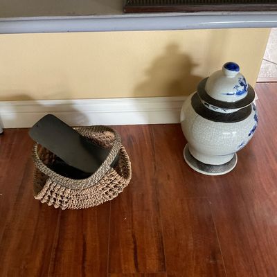 Sale Photo Thumbnail #87: Chinese crackle glaze porcelain ginger jar with lid, alongside a woven basket holding loose items under a folding table.