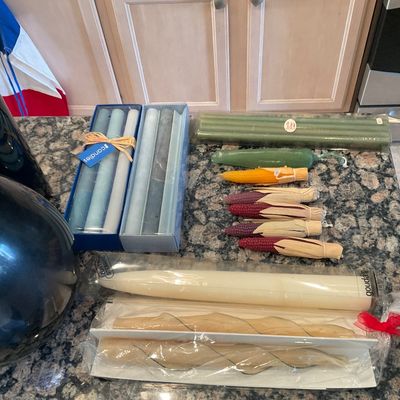 Sale Photo Thumbnail #107: Collection of decorative taper candles and novelty candles shaped like corn cobs, including boxed sets by Gouda and II Candles.