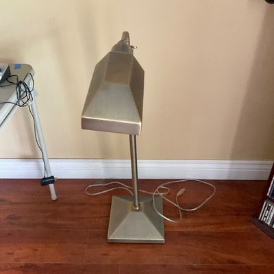 Sale Photo Thumbnail #72: Vintage brass-toned banker's desk lamp featuring a geometric shade and square pyramid base.