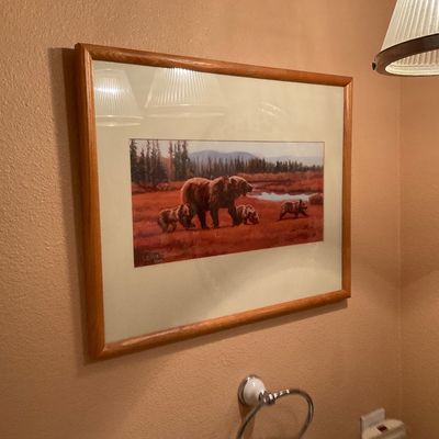 Sale Photo Thumbnail #65: Framed wildlife art print depicting a mother grizzly bear and three cubs in a wilderness landscape, set in a light oak frame under glass.