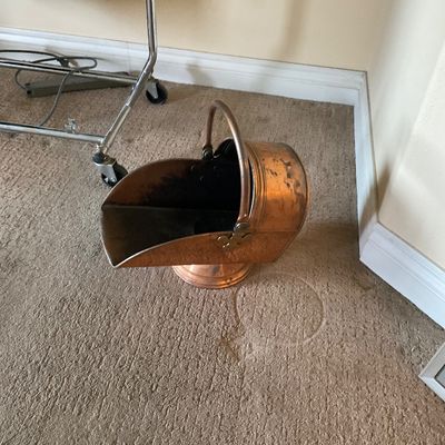 Sale Photo Thumbnail #156: Vintage copper scuttle bucket with a brass-accented swing handle and round pedestal base.