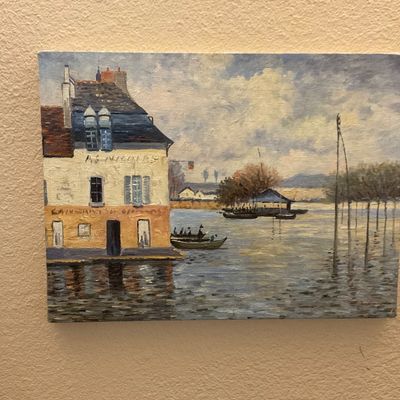 Sale Photo Thumbnail #160: Unframed Impressionist-style oil painting on canvas depicting a riverside village scene with a building and small boats.