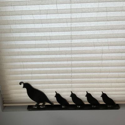 Sale Photo Thumbnail #118: Black metal quail family windowsill sculpture depicting a mother quail leading four chicks.