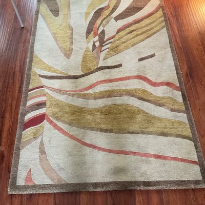 Sale Photo Thumbnail #178: Contemporary abstract area rug featuring wavy, organic shapes in earthy tones of tan, brown, gold, and terracotta.