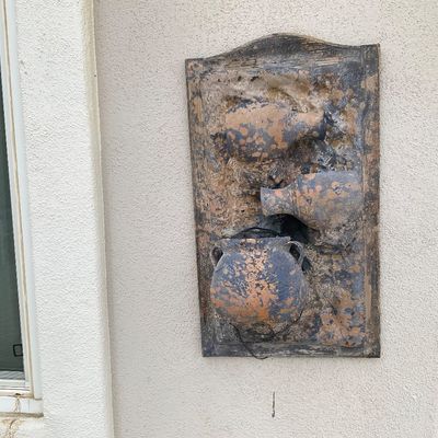 Sale Photo Thumbnail #20: Rustic rustic-style 3D wall plaque featuring embedded terracotta-style pots on a textured wooden backing.