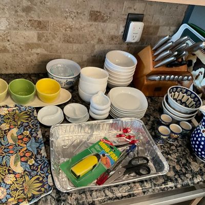 Sale Photo Thumbnail #106: Assorted kitchenware including ceramic bowls, a wooden knife block with stainless steel knives, Polish pottery pitcher and egg cups, and a William Morris floral tray.