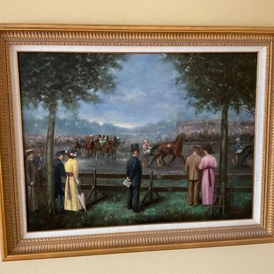 Sale Photo Thumbnail #92: Framed oil painting depicting spectators watching a harness race, presented in a molded gold-finished frame with a white inner liner.