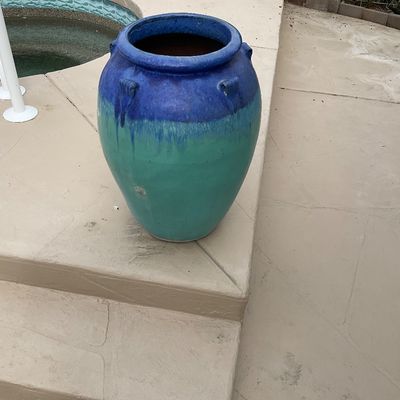 Sale Photo Thumbnail #23: Large glazed ceramic urn-style planter featuring a two-tone cobalt blue and turquoise ombre drip finish, shown poolside.