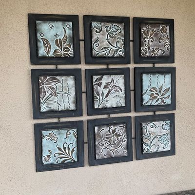 Sale Photo Thumbnail #47: Nine-panel metal wall art featuring embossed floral and damask motifs in dark frames, linked in a grid pattern with a weathered copper finish.