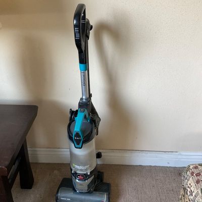 Sale Photo Thumbnail #151: Bissell MultiClean Allergen Lift-Off upright vacuum cleaner in black and teal, featuring a detachable canister and tangle-free brush roll.