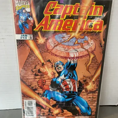 Sale Photo Thumbnail #67: Marvel Comics Captain America #13, published January 1999, written by Mark Waid with art by Andy Kubert. The comic is bagged and boarded in collectible condition.