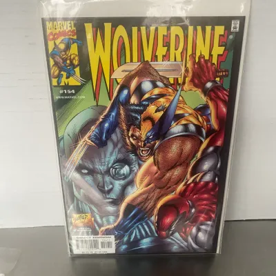 Sale Photo Thumbnail #104: Marvel Comics Wolverine #154, September 2000 edition, featuring cover art by Rob Liefeld and presented in a protective plastic sleeve with backing board.
