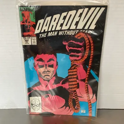 Sale Photo Thumbnail #24: Marvel Comics Daredevil #268 from July 1989, featuring cover art by John Romita Jr. and Al Williamson, stored in a protective plastic sleeve.