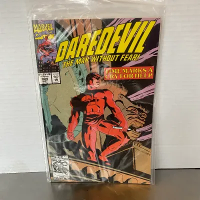 Sale Photo Thumbnail #15: Marvel Comics Daredevil #304 comic book, dated May 1992, sealed in a protective plastic sleeve.