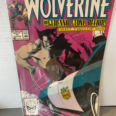 Sale Photo Thumbnail #81: Marvel Comics Wolverine #12, published in late September 1989, featuring 'The Gehenna Stone Affair! Part Two of Six' storyline, sealed in a protective plastic sleeve.