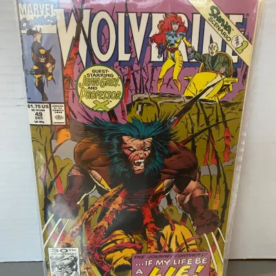 Sale Photo Thumbnail #92: Marvel Comics Wolverine issue #49 from December 1991, guest-starring Jean Grey and Professor X, housed in a protective plastic shell.