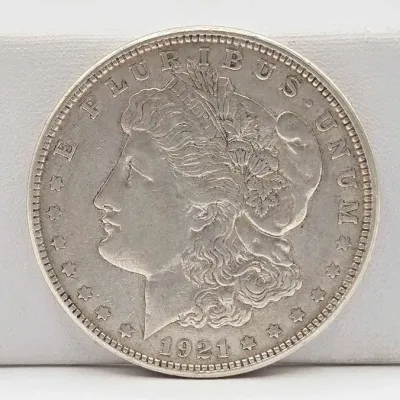 Sale Photo Thumbnail #34: 53 1921 d morgan silver dollar