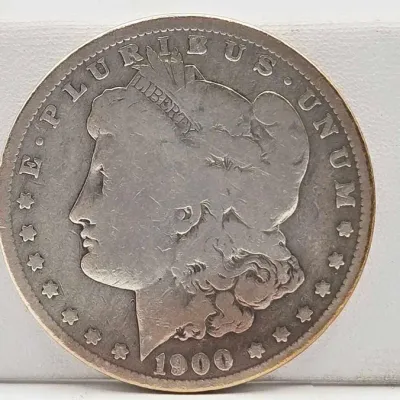 Sale Photo Thumbnail #38: 57 1900 o morgan silver dollar