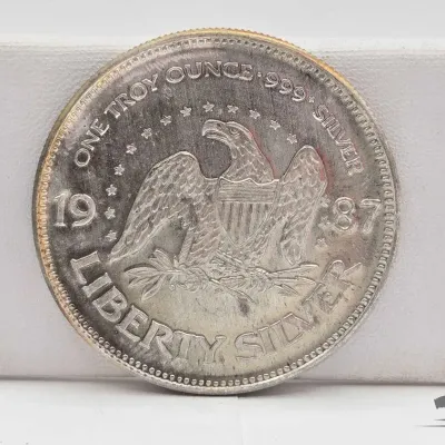 Sale Photo Thumbnail #26: 45 1987 a mark 1oz silver round