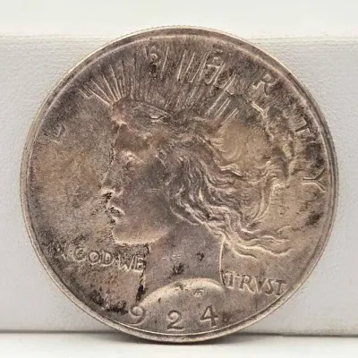 Sale Photo Thumbnail #44: 63 1924 silver peace dollar