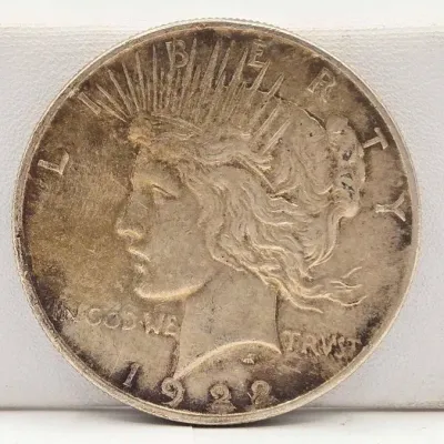 Sale Photo Thumbnail #42: 61 1922 silver peace dollar