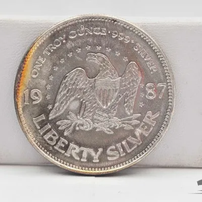 Sale Photo Thumbnail #27: 46 1987 a mark 1oz silver round