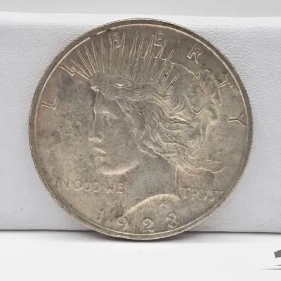 Sale Photo Thumbnail #43: 62 1923 silver peace dollar