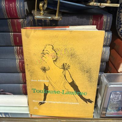 Hardcover art book titled 'Toulouse-Lautrec: His complete lithographs and drypoints' by Jean Adhémar, featuring a yellow dust...