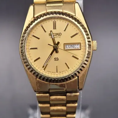 Seiko Women's Gold-Tone Day-Date Wristwatch with Fluted Bezel and Link Bracelet