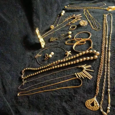 Gold-Tone Costume Necklace Lot: Bead Strands, Sunburst Pendant, Pearl-Style Earrings, Dolphin Clock