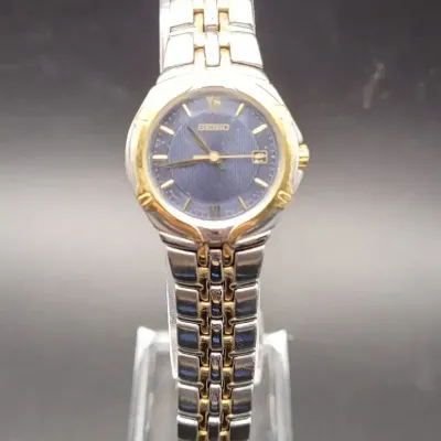 Seiko Women's Two-Tone Stainless Steel Wristwatch with Blue Dial, Caseback 7N82-0AT0
