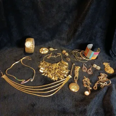 Gold-Tone Costume Jewelry Lot: Rhinestone Stretch Watch, Leaf Bib Necklace, Cameo Brooch, Bangles