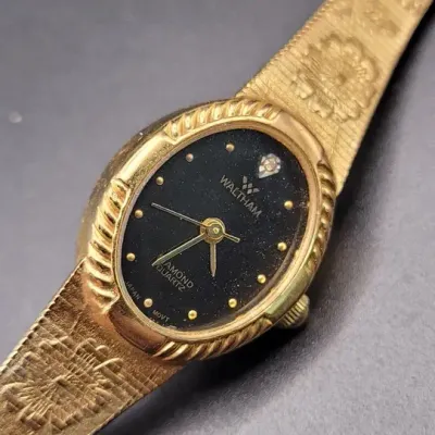 Waltham Diamond Quartz Women's Gold-Tone Oval Wristwatch with Black Dial and Floral Bracelet