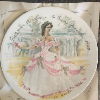 Sale Photo Thumbnail #2: Vintage 1976 porcelain decorative plate by François Ganeau, titled 'Scarlet en Crinoline - La Femme Inaccessible 1865', featuring a fashion illustration of a woman in a pink and white ballgown.
